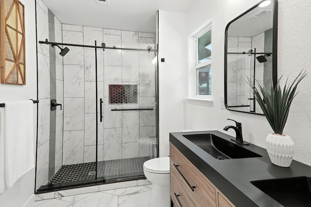 2207 Emerald Isle Dr, Leander, TX 78641 - bathroom with marble finish floors, double vanity, and a marble finish shower