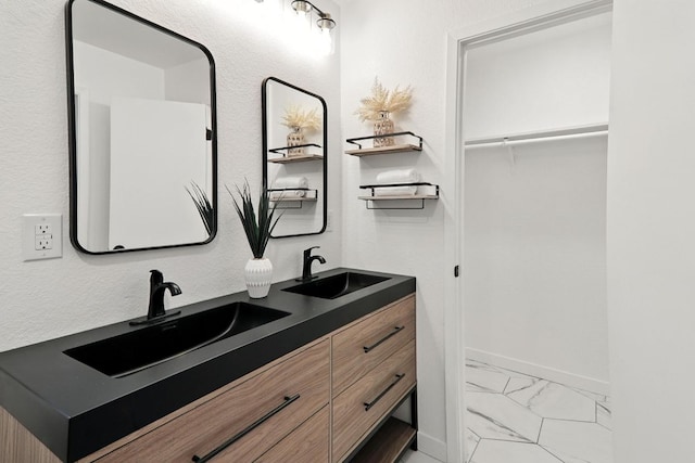 2207 Emerald Isle Dr, Leander, TX 78641 - full bathroom featuring marble look tiles and double vanity