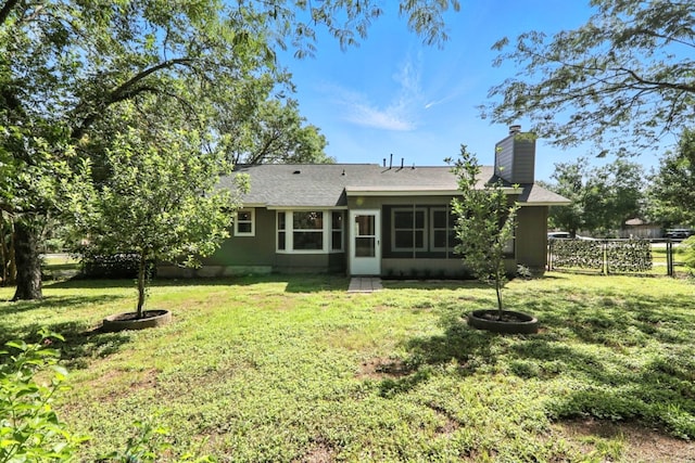 2207 Emerald Isle Dr, Leander, TX 78641 - back of house featuring a chimney and a shingled roof