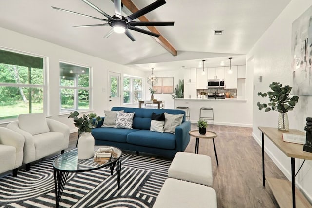 2207 Emerald Isle Dr, Leander, TX 78641 - living room with wood finished floors, ceiling fan, and a chandelier