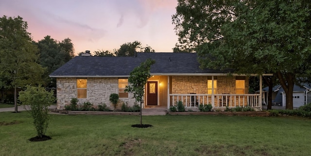2207 Emerald Isle Dr, Leander, TX 78641 - ranch-style house featuring stone siding, a porch, a front lawn, and a chimney