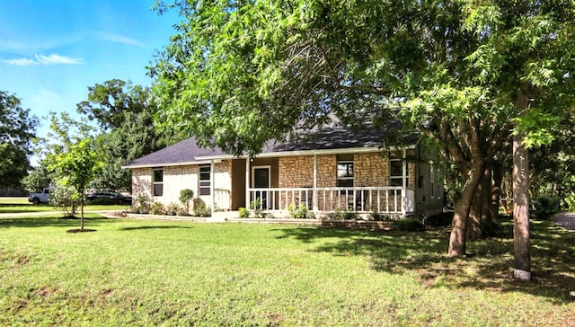 2207 Emerald Isle Dr, Leander, TX 78641 - single story home with stone siding and a front yard