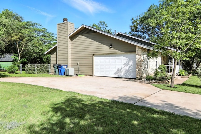 2207 Emerald Isle Dr, Leander, TX 78641 - view of property exterior featuring driveway, a garage, and a chimney