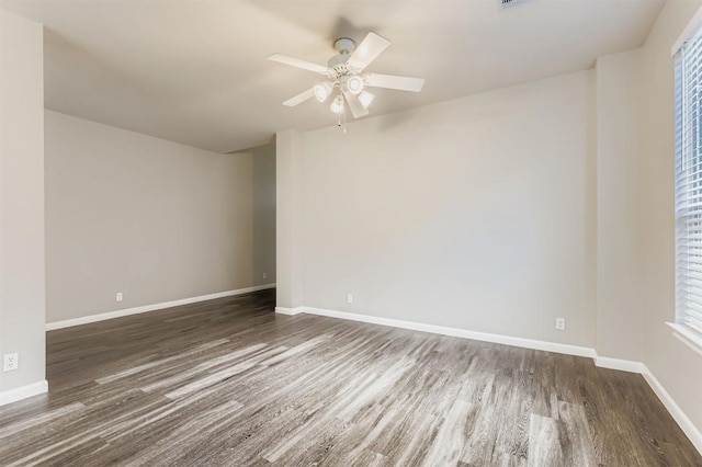 6050 Almelo Dr, Round Rock, TX 78681 - empty room featuring wood finished floors, ceiling fan, and plenty of natural light