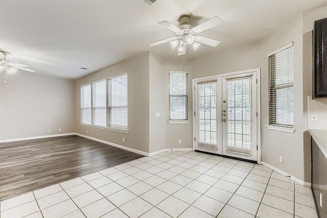 6050 Almelo Dr, Round Rock, TX 78681 - empty room featuring a ceiling fan, french doors, and light tile patterned floors