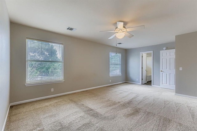 6050 Almelo Dr, Round Rock, TX 78681 - spare room featuring plenty of natural light, light colored carpet, and a ceiling fan
