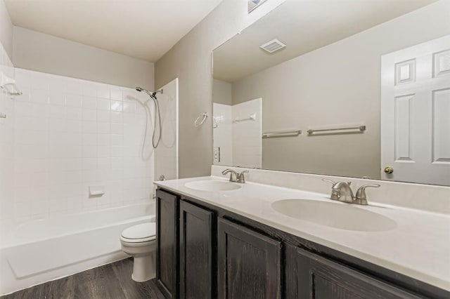6050 Almelo Dr, Round Rock, TX 78681 - full bath featuring bathtub / shower combination, wood finished floors, and double vanity