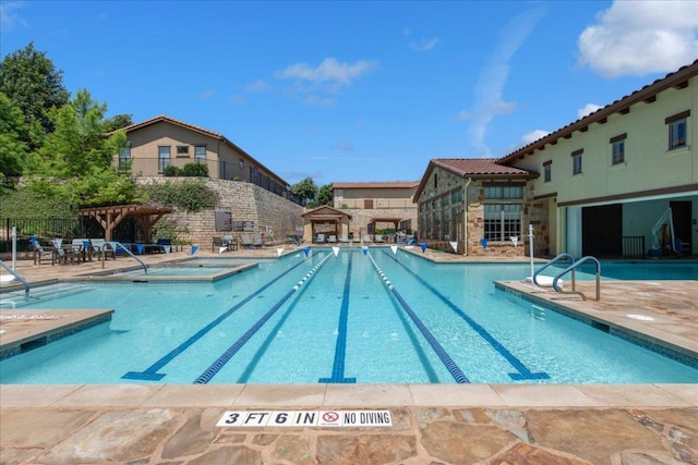 205 Versilia Cir, Lakeway, TX 78734 - community pool featuring a hot tub and a patio