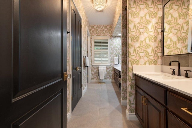 205 Versilia Cir, Lakeway, TX 78734 - full bathroom featuring wallpapered walls, vanity, and tile patterned floors