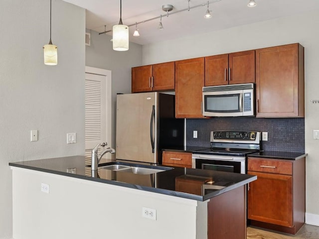 3016 Guadalupe St Unit 211, Austin, TX 78705 - kitchen with appliances with stainless steel finishes, dark countertops, and tasteful backsplash