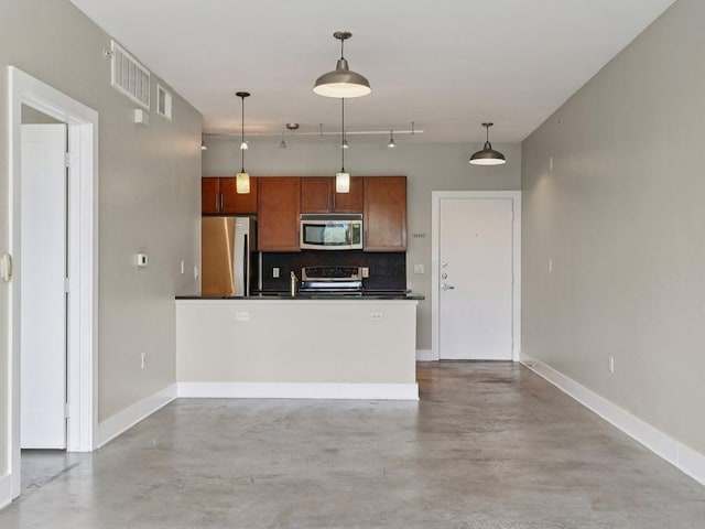 3016 Guadalupe St Unit 211, Austin, TX 78705 - kitchen featuring stainless steel appliances, dark countertops, finished concrete flooring, and tasteful backsplash