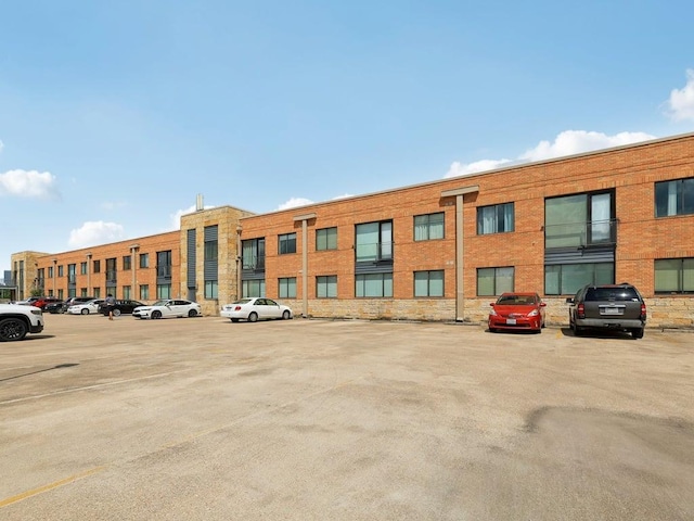 3016 Guadalupe St Unit 211, Austin, TX 78705 - view of building exterior with uncovered parking