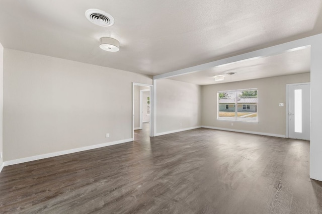 5302 Robinsdale Ln, Austin, TX 78723 - unfurnished living room featuring dark wood-style flooring and baseboards