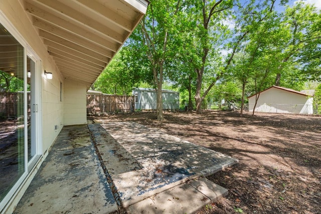 5302 Robinsdale Ln, Austin, TX 78723 - fenced backyard with a patio area