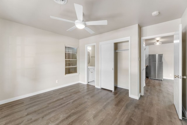 5302 Robinsdale Ln, Austin, TX 78723 - unfurnished bedroom featuring dark wood finished floors, a closet, connected bathroom, and ceiling fan