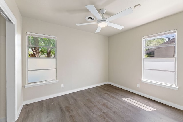 5302 Robinsdale Ln, Austin, TX 78723 - empty room with wood finished floors and a ceiling fan