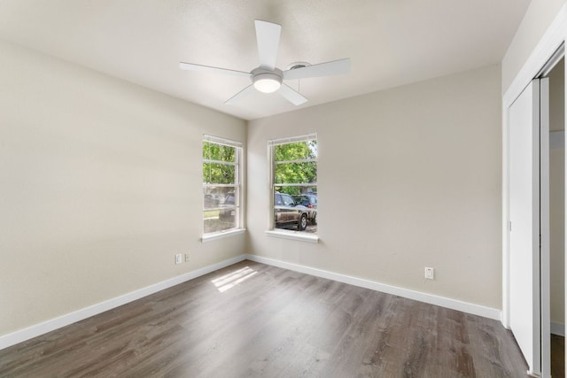 5302 Robinsdale Ln, Austin, TX 78723 - empty room featuring dark wood-style flooring and a ceiling fan