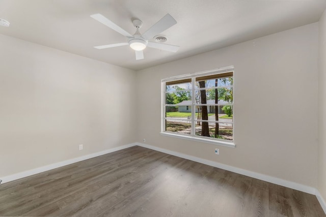 5302 Robinsdale Ln, Austin, TX 78723 - spare room featuring wood finished floors, a smoke detector, and ceiling fan