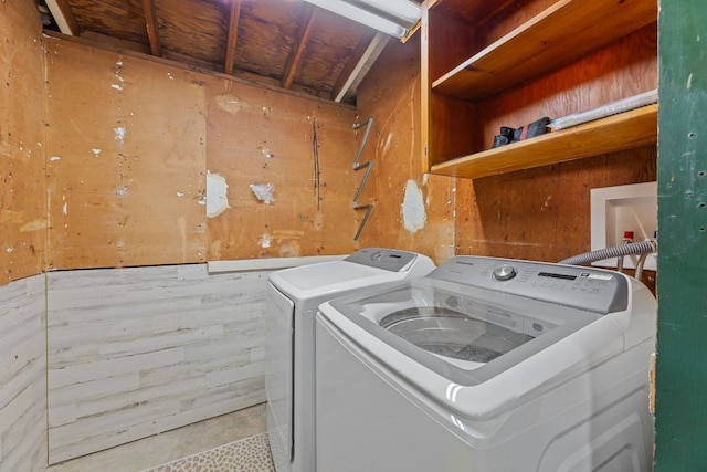 5302 Robinsdale Ln, Austin, TX 78723 - laundry room with independent washer and dryer and wooden walls