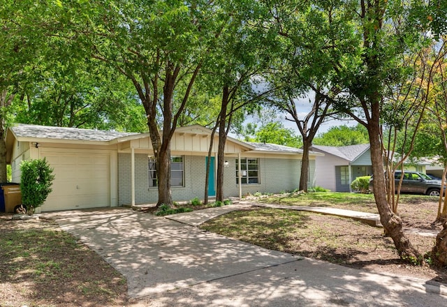 5302 Robinsdale Ln, Austin, TX 78723 - single story home featuring brick siding, an attached garage, and driveway