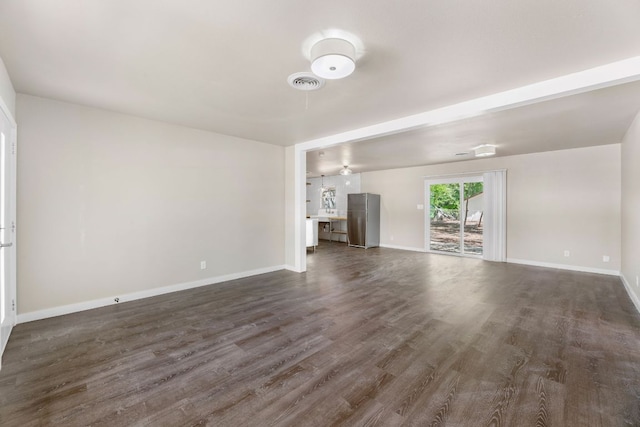 5302 Robinsdale Ln, Austin, TX 78723 - unfurnished living room with dark wood finished floors and baseboards