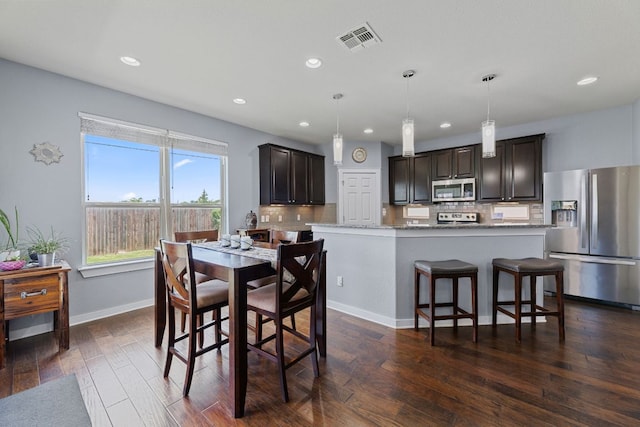 16216 Travesia Way, Austin, TX 78728 - dining room featuring recessed lighting and dark wood finished floors