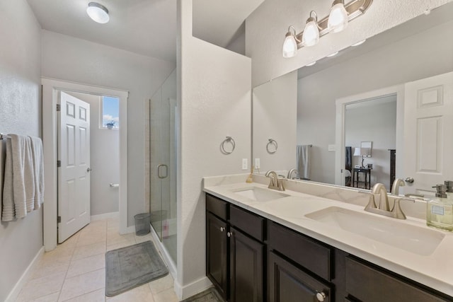 16216 Travesia Way, Austin, TX 78728 - bathroom with double vanity, a shower stall, and tile patterned floors