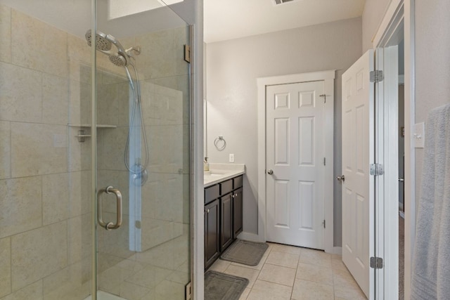 16216 Travesia Way, Austin, TX 78728 - full bathroom featuring a stall shower, tile patterned floors, and vanity