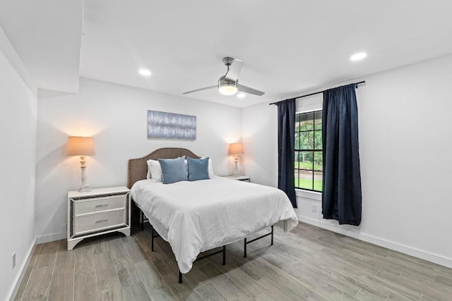 3520 Highland View Dr, Austin, TX 78731 - bedroom featuring wood finished floors, a ceiling fan, and recessed lighting
