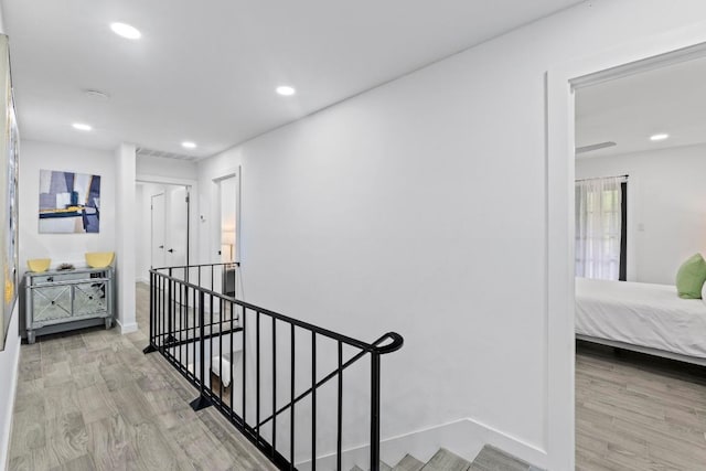 3520 Highland View Dr, Austin, TX 78731 - hallway featuring an upstairs landing, wood finished floors, and recessed lighting