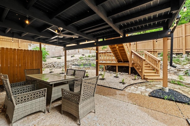 3520 Highland View Dr, Austin, TX 78731 - fenced backyard featuring a patio, stairs, and outdoor dining space