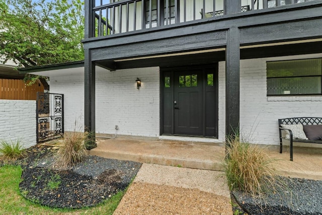 3520 Highland View Dr, Austin, TX 78731 - property entrance with brick siding and a balcony