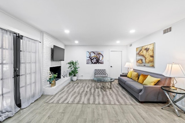 3520 Highland View Dr, Austin, TX 78731 - living area featuring wood finished floors, recessed lighting, and a fireplace