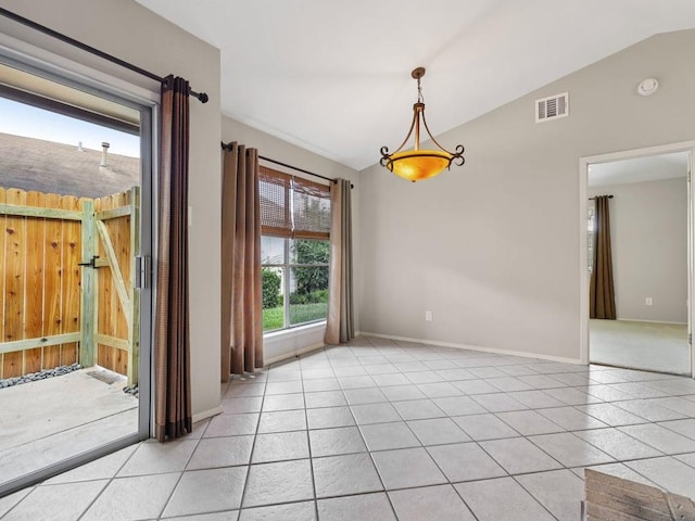 11608 Norwegian Wood Dr, Austin, TX 78758 - empty room featuring vaulted ceiling, light tile patterned flooring, and a smoke detector