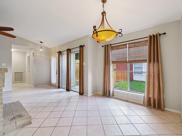 11608 Norwegian Wood Dr, Austin, TX 78758 - spare room with light tile patterned floors, lofted ceiling, and a ceiling fan
