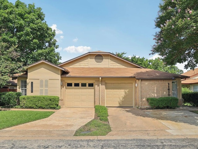 11608 Norwegian Wood Dr, Austin, TX 78758 - ranch-style house featuring an attached garage, concrete driveway, and brick siding