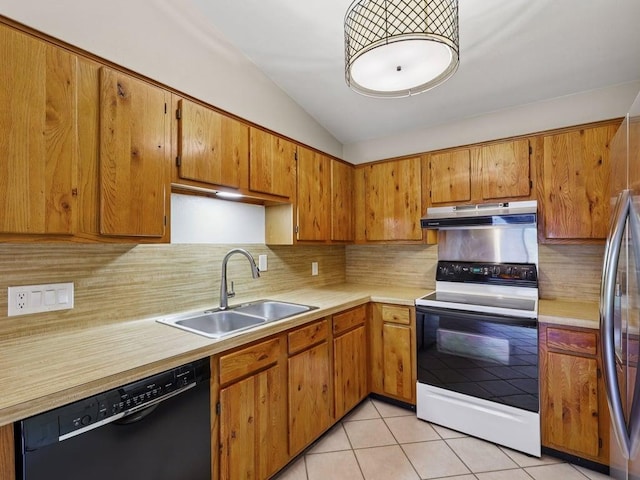 11608 Norwegian Wood Dr, Austin, TX 78758 - kitchen with black dishwasher, electric range, under cabinet range hood, vaulted ceiling, and light countertops