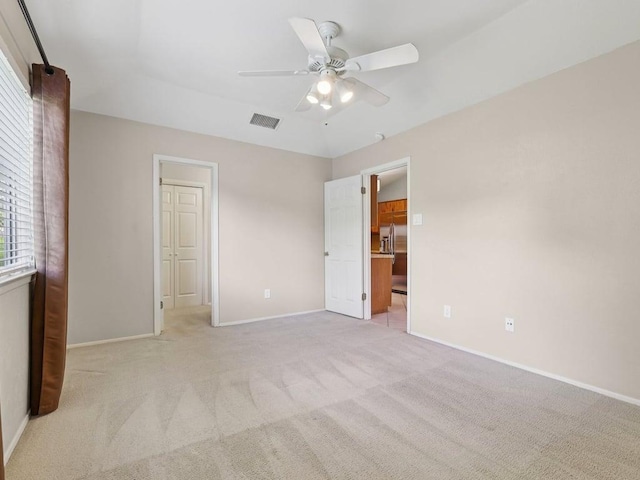 11608 Norwegian Wood Dr, Austin, TX 78758 - unfurnished bedroom featuring light carpet and ceiling fan