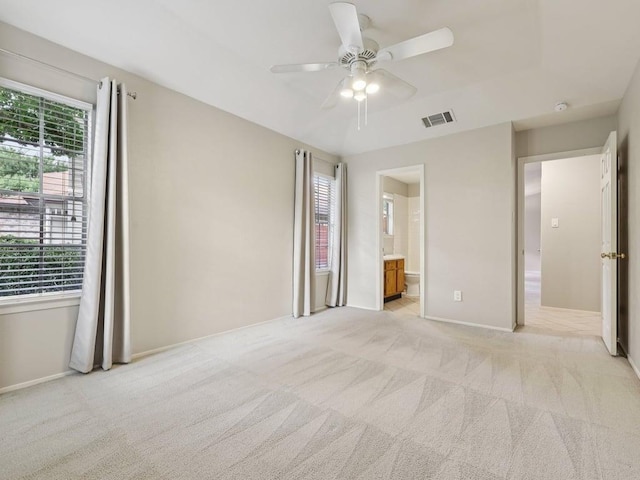 11608 Norwegian Wood Dr, Austin, TX 78758 - unfurnished bedroom with light carpet, connected bathroom, and a ceiling fan