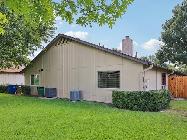 11608 Norwegian Wood Dr, Austin, TX 78758 - view of property exterior featuring a central air condition unit and a chimney