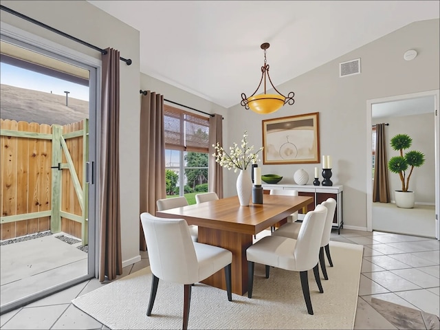 11608 Norwegian Wood Dr, Austin, TX 78758 - dining area with lofted ceiling and light tile patterned flooring