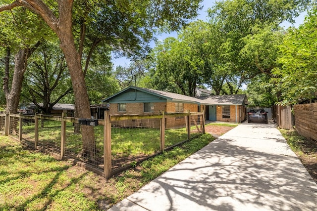 4108 Lewis Ln Unit A & B, Austin, TX 78756 - single story home with driveway, brick siding, a fenced front yard, and a gate