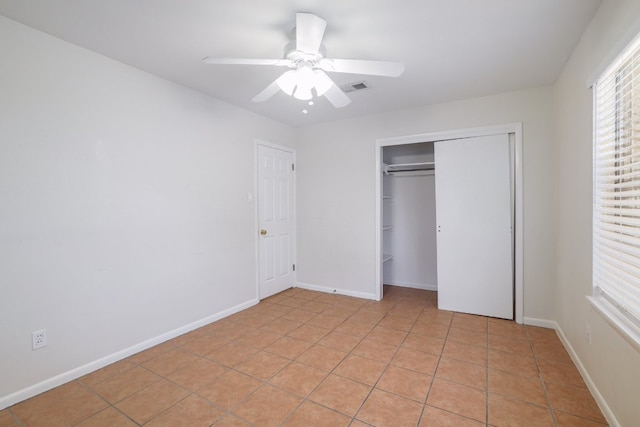 4108 Lewis Ln Unit A & B, Austin, TX 78756 - unfurnished bedroom featuring light tile patterned flooring, a ceiling fan, and a closet