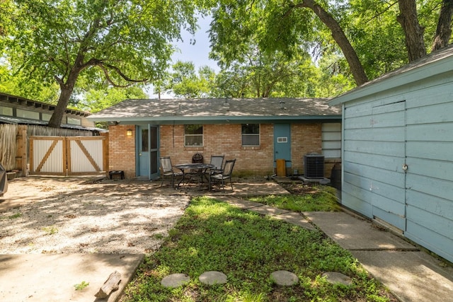 4108 Lewis Ln Unit A & B, Austin, TX 78756 - back of house with brick siding, a patio area, and a gate