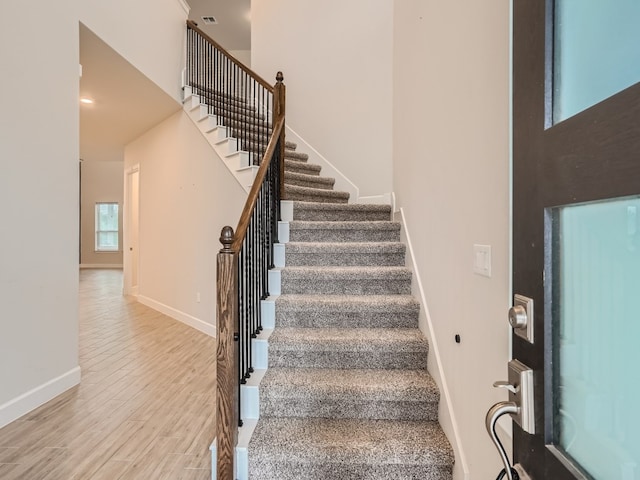 2800 Sebring Cir, Austin, TX 78747 - stairway with wood finished floors and a high ceiling