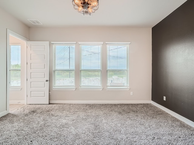 2800 Sebring Cir, Austin, TX 78747 - carpeted spare room featuring healthy amount of natural light and a chandelier