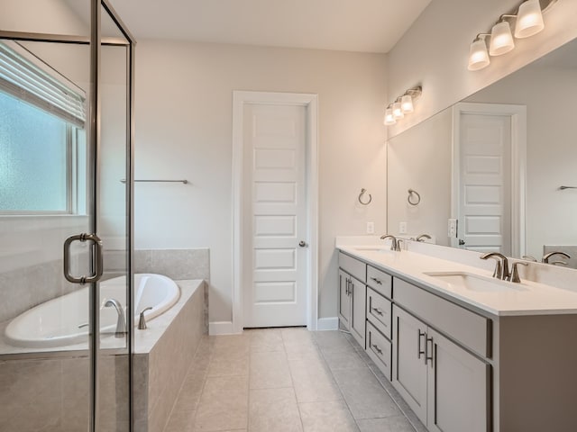 2800 Sebring Cir, Austin, TX 78747 - bathroom featuring a bath, double vanity, tile patterned floors, and an enclosed shower