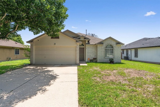 208 Meadowside Dr, Hutto, TX 78634 - ranch-style home featuring concrete driveway, brick siding, a garage, and a front lawn