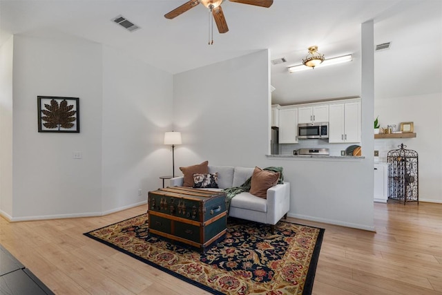 208 Meadowside Dr, Hutto, TX 78634 - living room featuring a ceiling fan and light wood finished floors