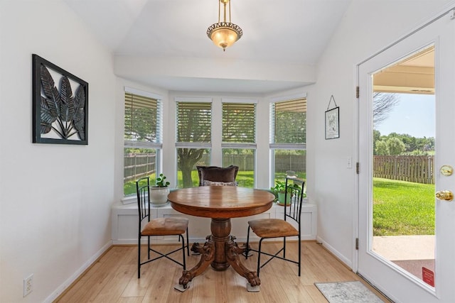 208 Meadowside Dr, Hutto, TX 78634 - dining space featuring light wood-style floors and vaulted ceiling